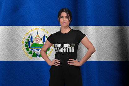 Woman wearing El Salvador National Motto 'Dios Unión Libertad' T-Shirt, featuring the coat of arms, promoting Patriotic El Salvador Clothing.