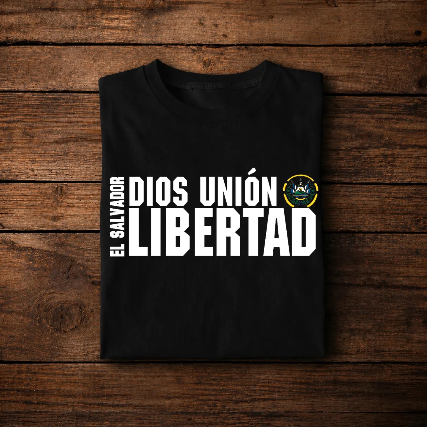 Patriotic El Salvador Clothing featuring 'DIOS UNIÓN LIBERTAD' with the Salvadoran Coat of Arms on a black t-shirt.